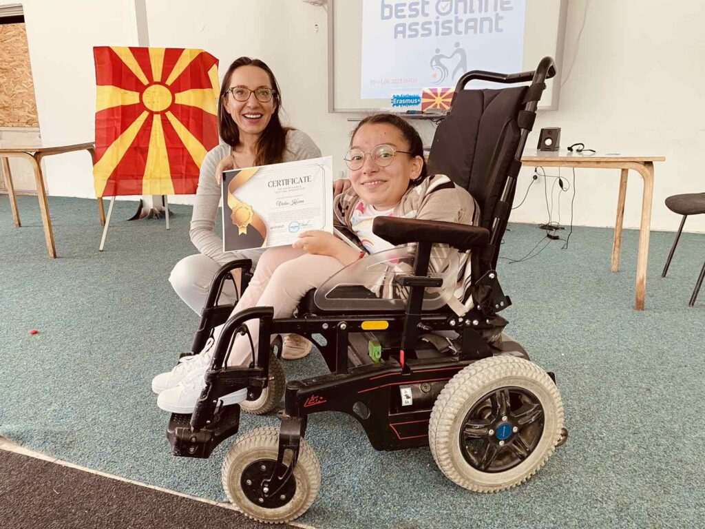 Vecka Koceva, a person with cerebral palsy accepting the diploma.