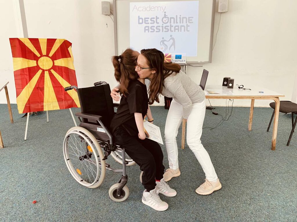 Jana Dimova, a person with cerebral palsy accepting the diploma.